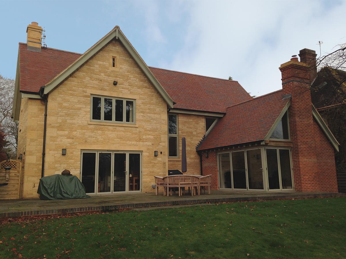 a self build in the Cotswolds with Brown Antique rustic clay roof tiles
